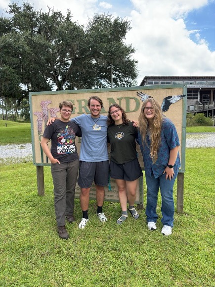 photo of college students smiling at the camera