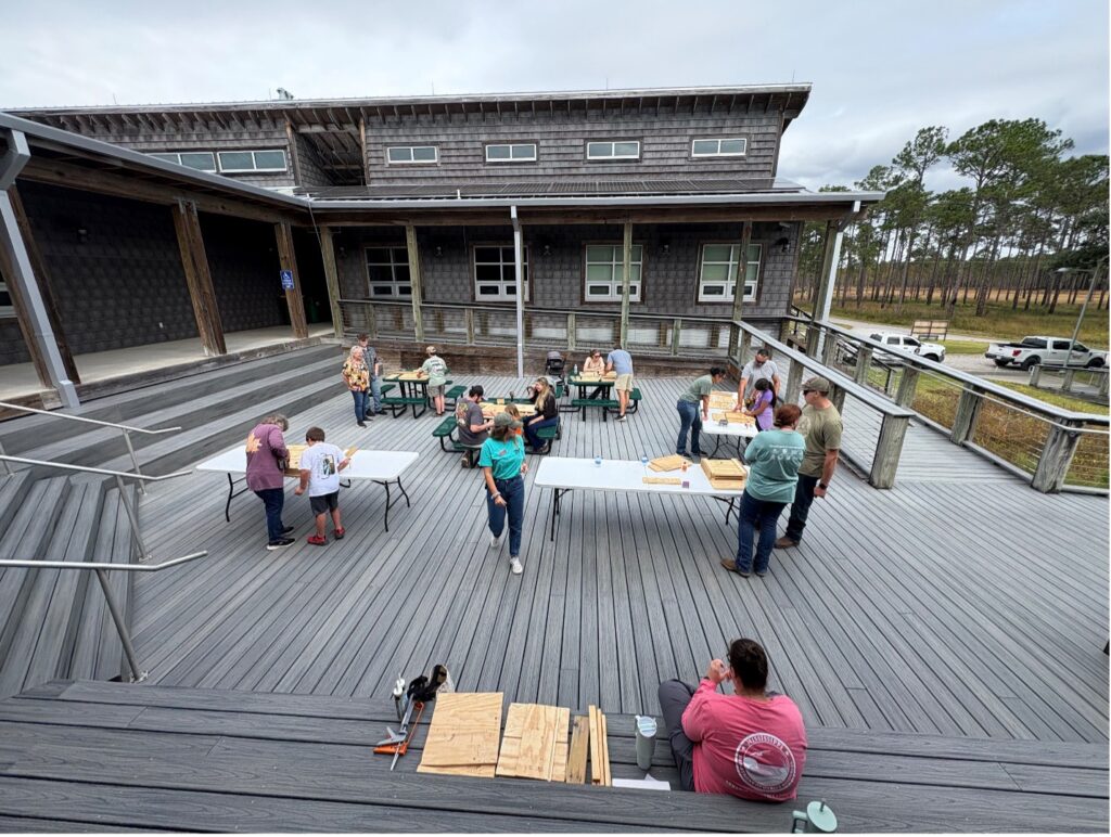 an outdoor classroom set up on the deck of a building